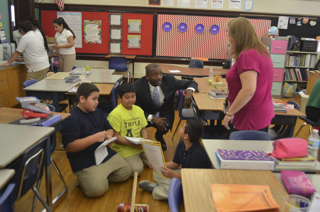 KCPS Superintendent Dr. Mark Bedell engages with James Elementary students during a Thursday, December 1 tour of the school.