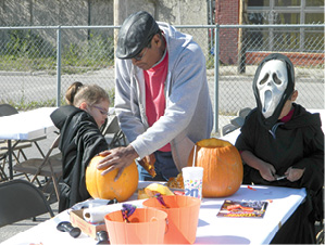 FRONT PAGE__VFW pumpkin carving-grp of 3.tif