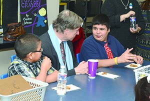 A chat with Kemper. R. Crosby Kemper III munches on his favorite cookie, chocolate chip, while chatting with Gladstone Elementary sixth graders. Kemper recently visited the school and spent more than two hours with the students. Leslie Collins 