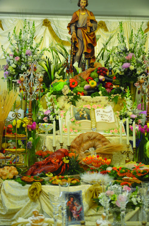 The St. Joseph table at Holy Rosary is decorated with cookies and other food, as well as flowers. 