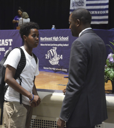 KCPS Superintendent Dr. Mark Bedell speaks with a student after his speech at Northeast on Tuesday, August 30.