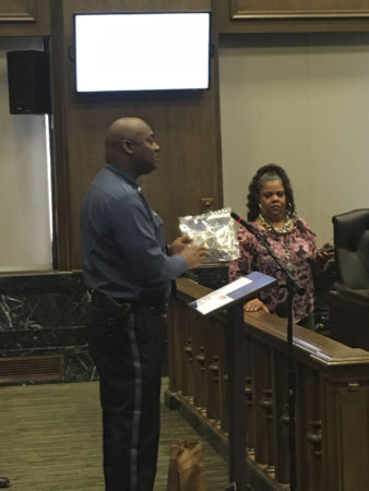 KCPD Deputy Chief Karl Oakman shows City Council members what 35 grams of marijuana looks like. 