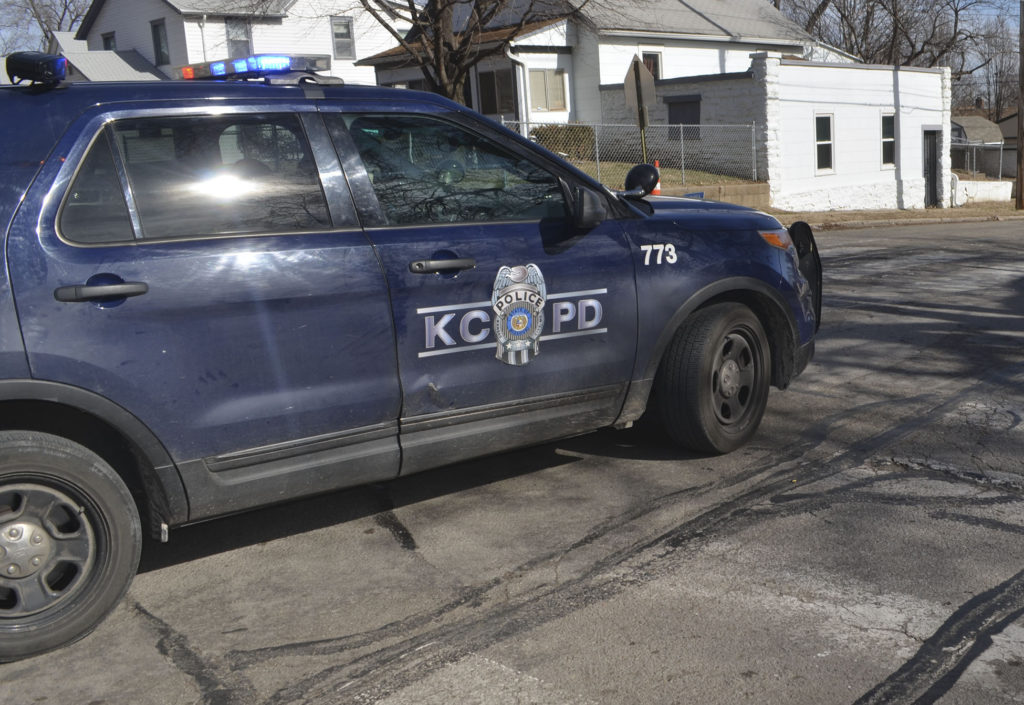 A KCPD vehicle parks in the middle of the intersection of N. Bellaire and Scarritt in the Historic Northeast. Several bullet casings were found in the intersection, which is across the street from James Elementary School. 