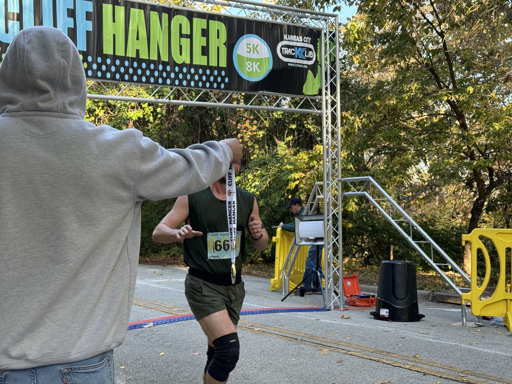 Runner receives medal after finishing Cliffhanger race Saturday, Oct. 26 | Photo by Julia Williams